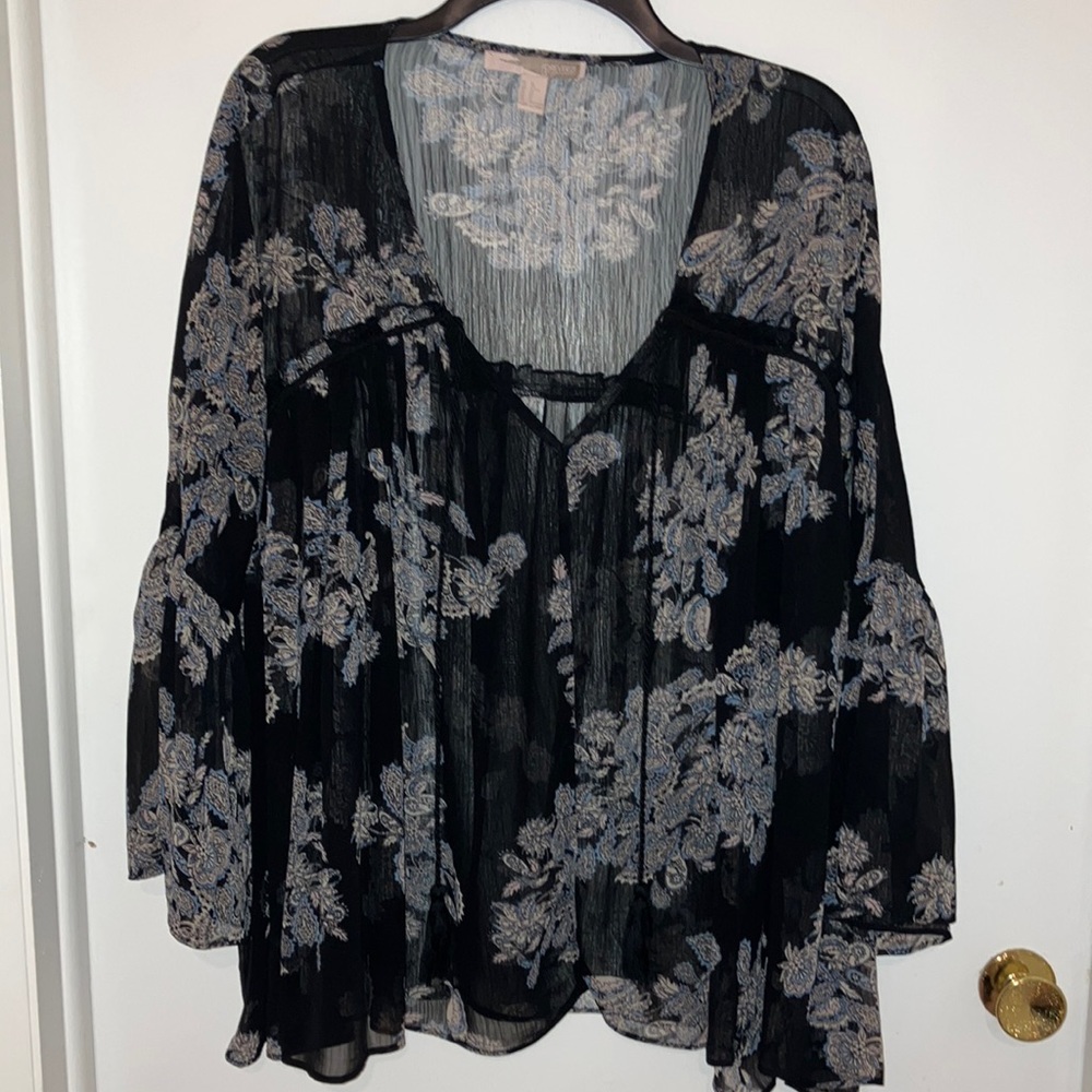 Flowy black blouse, with pink and blue flower and paisley prints.